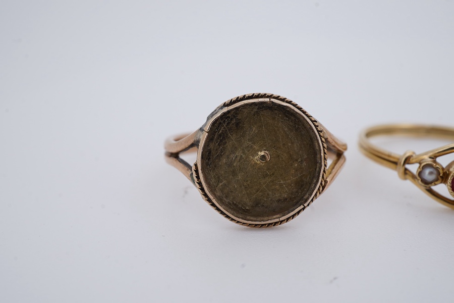 Three rings, comprising: a synthetic ruby and seed pearl ring, size O, French assay marks for 18ct gold, French maker's mark; an opal and seed pearl half-hoop ring in 9ct gold, size M1/2, British hallmarks; and a gold ri